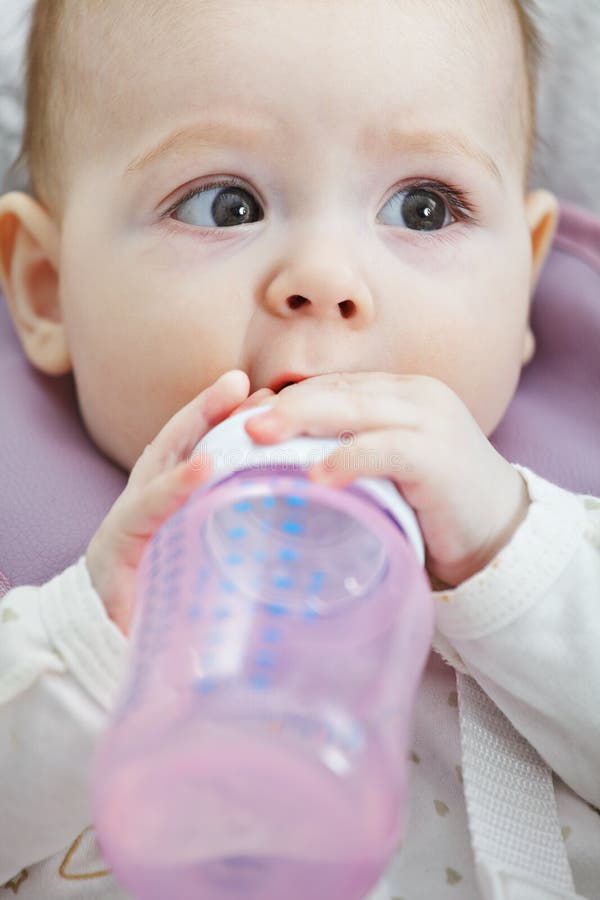 Baby with bottle stock photo. Image of infant, laying 14903910