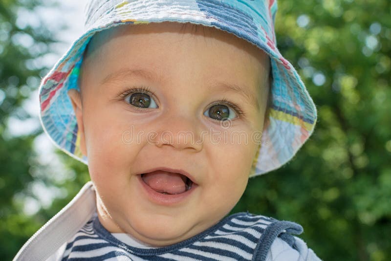 Cute Baby Boy with Pacifier Looking at the Camera. Boy with Pacifier