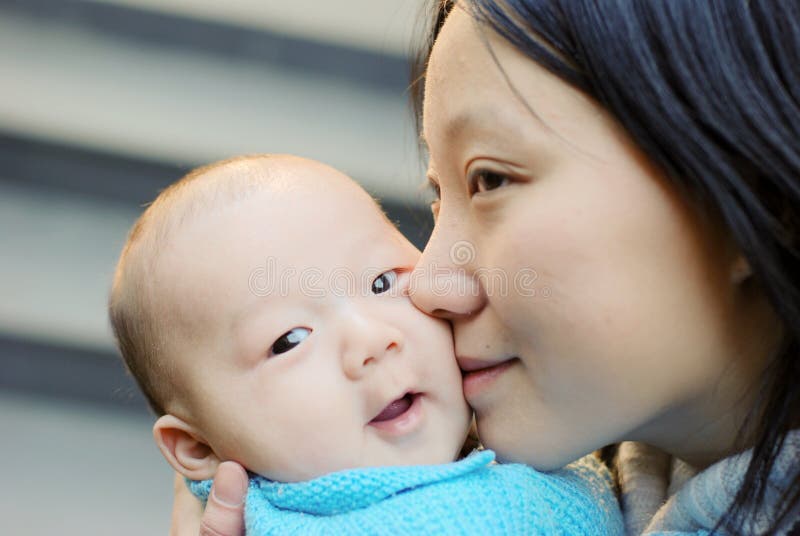 Cute baby boy and mother