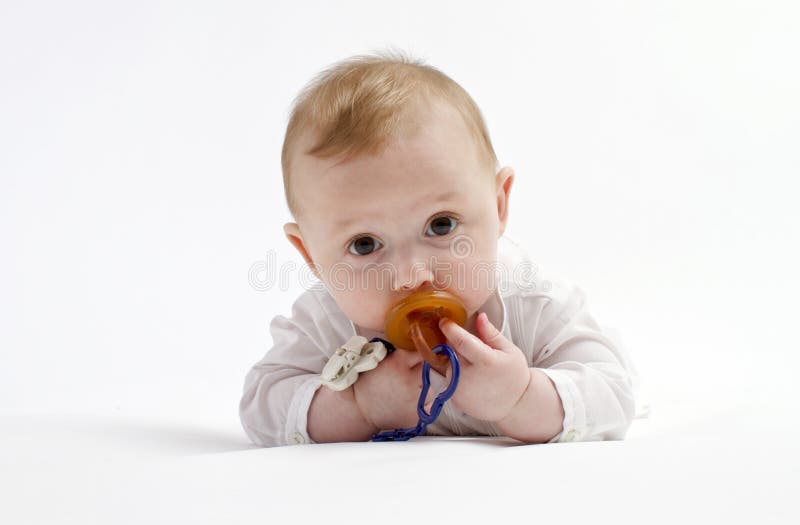 Cute baby boy with pacifier royalty free stock photo
