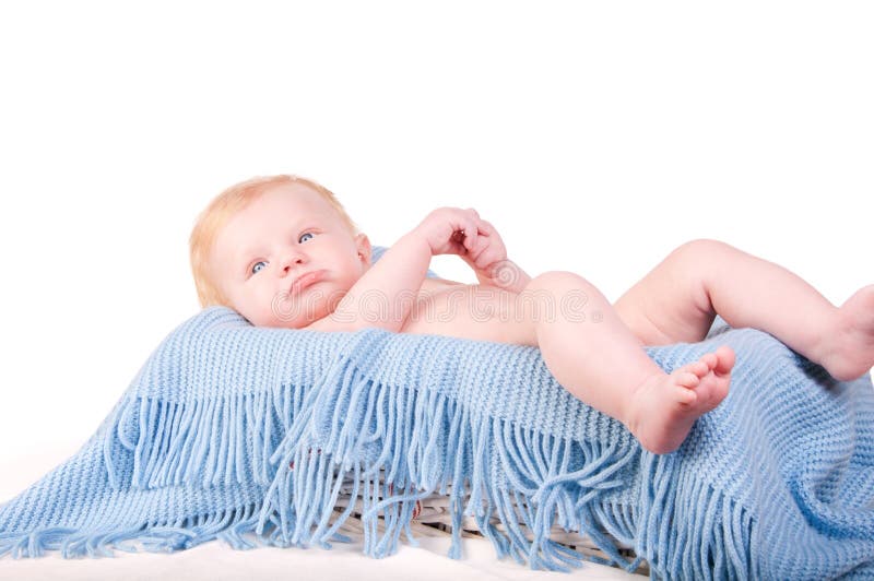 Cute Baby boy s portrait on blue blanket