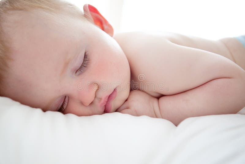 Cute baby boy sleeping royalty free stock photography