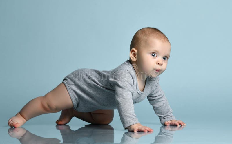 Cute baby boy on white background with isolation path. Cute baby girl crawls on a white background with isolation path stock photos Cute baby boy on white background with isolation path. Cute baby girl crawls on a white background with isolation path stock photos