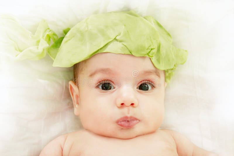 Cute baby in cabbage hat