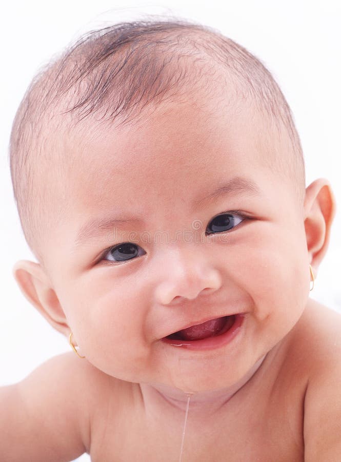 Cute baby smiling and drooling over white background. Cute baby smiling and drooling over white background