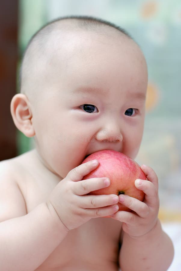 Cute baby eat apple