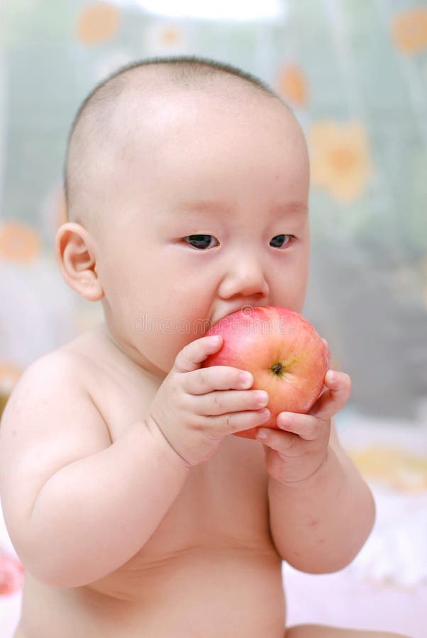 Cute Baby Eat Apple Picture. Image 10034554