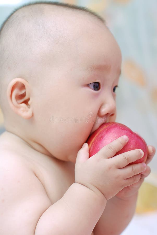 Cute baby eat apple