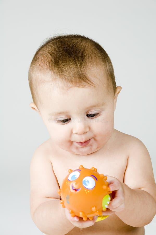 Cute Baby with Fish Toy stock photo. Image of cute, looking 17095232