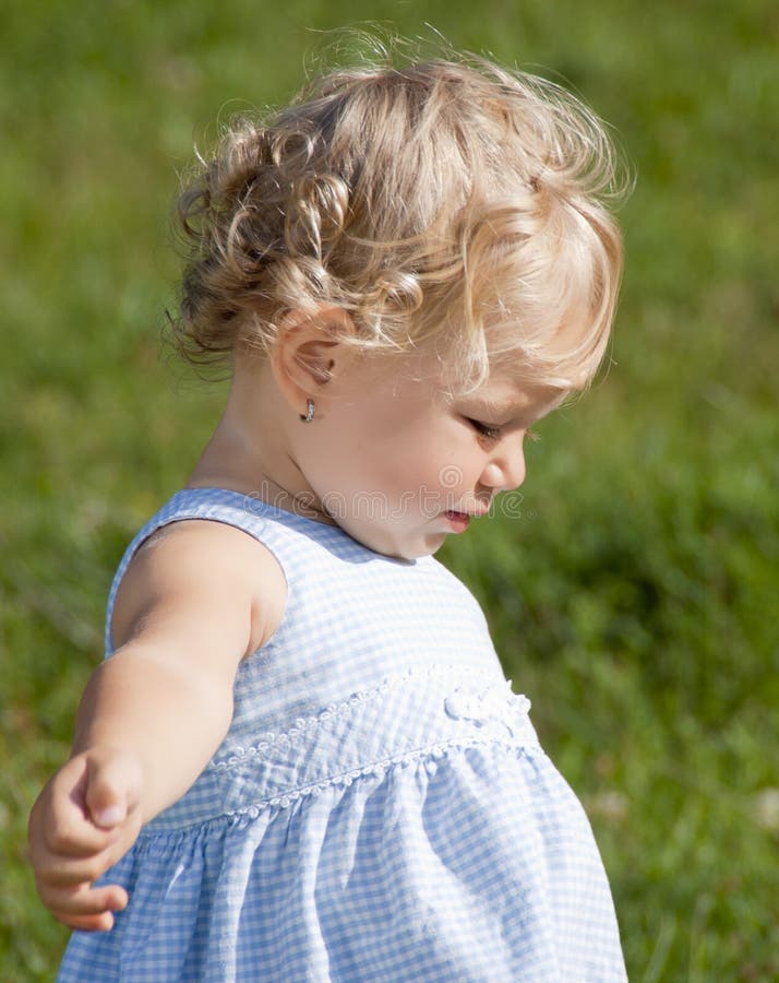 Cute baby girl in the par royalty free stock photography