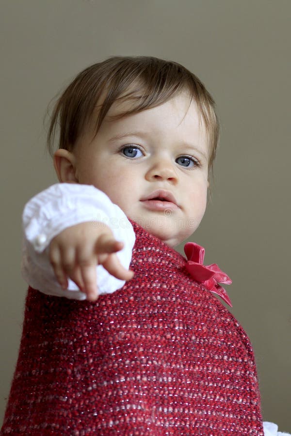 Cute baby girl pointing royalty free stock photography