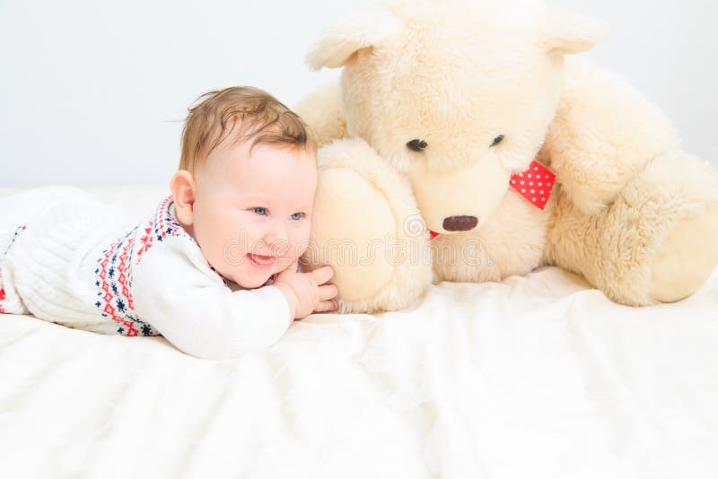 Cute baby girl and teddy bear