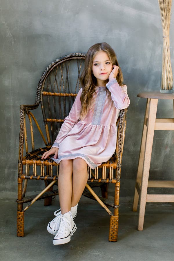 Cute Baby Girl 5-6 Year Old Wearing Stylish Pink Dress Sitting on the ...