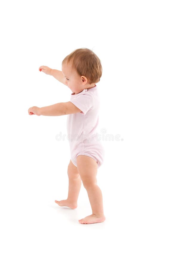 Cute baby making first steps stock photography