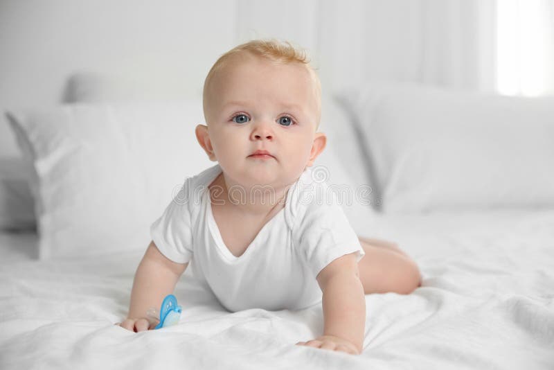 Cute Baby with Pacifier Lying on Bed Stock Photo Image of funny