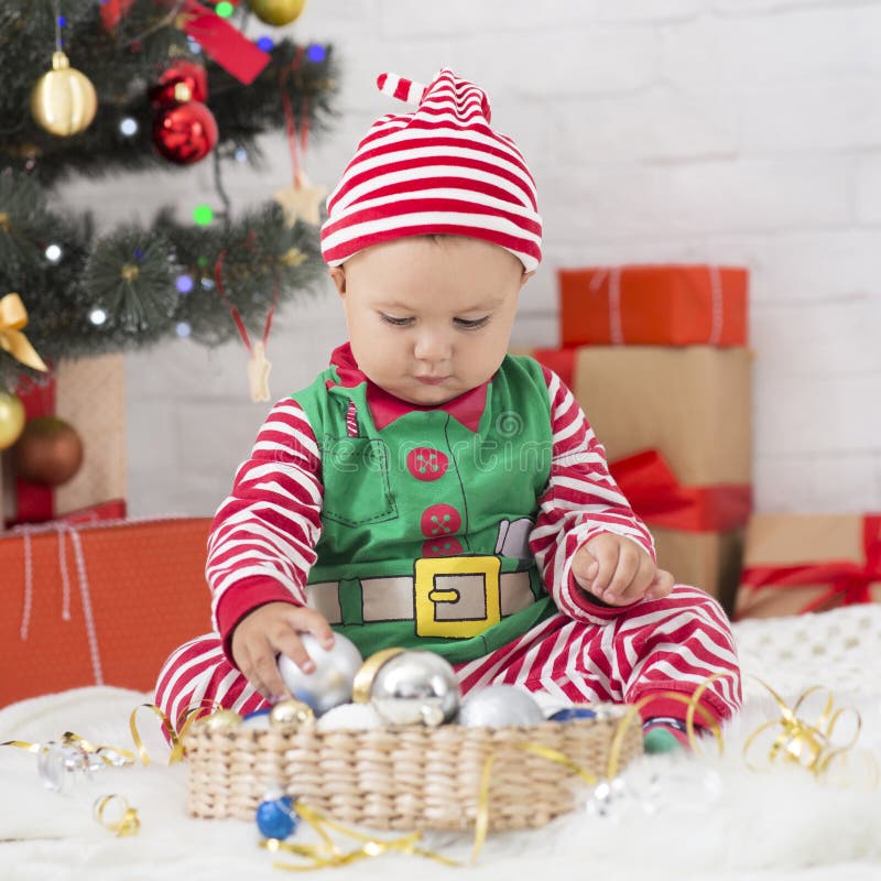 Cute Baby Sorting Christmas Decorations at Home Stock Image Image of christmas, celebrate