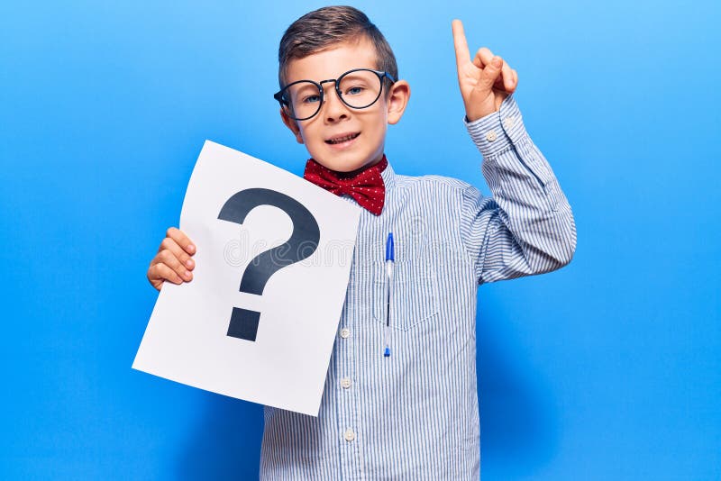 Cute Blond Kid Wearing Nerd Bow Tie and Glasses Holding Question Mark ...