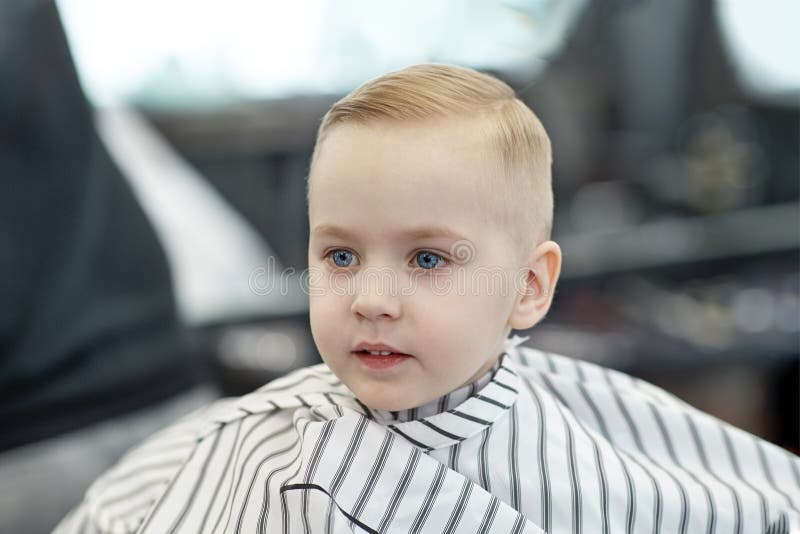 Cute Blond Smiling Baby Boy with Blue Eyes in a Barber Shop after Haircut  by Hairdresser. Children Fashion in Salon Stock Image - Image of caucasian,  drape: 147595229