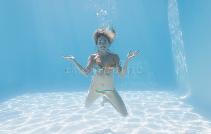 Cute Blonde Smiling At Camera Underwater In The