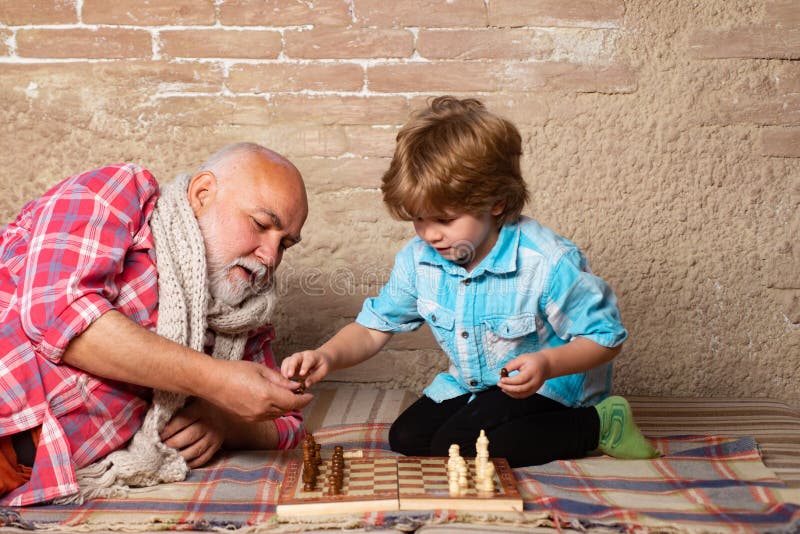 Senior man thinking about his next move in a game of chess Stock Photo by  dmytros9