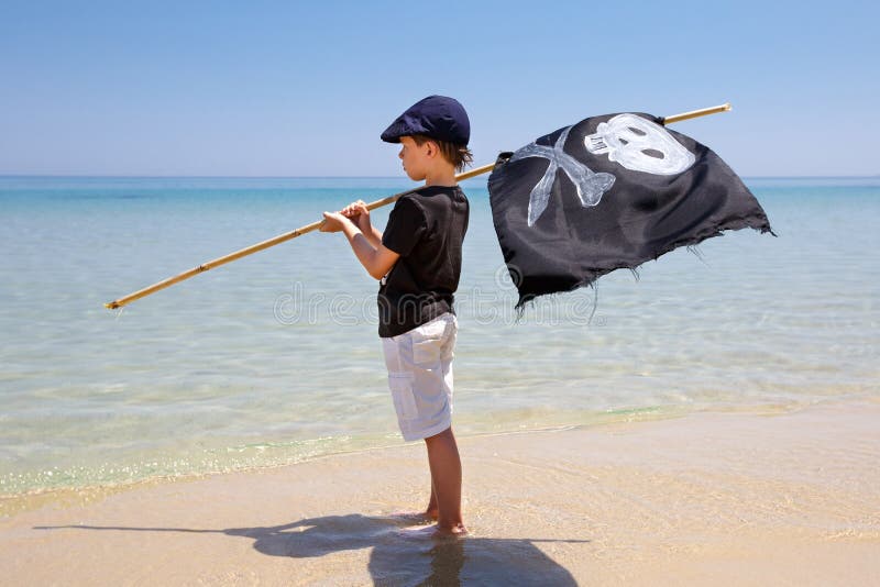 Cute boy dressed as pirate on tropical beach royalty free stock images Cute boy dressed as pirate on tropical beach royalty free stock images