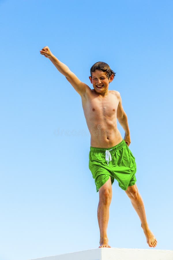 Cute boy posing on a roof