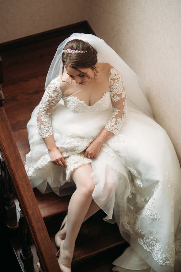 Cute Bride Dressed at Home in a Wedding Dress Stock Photo - Image of ...