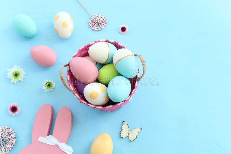 Cute Bunny Next To Easter Colorful Eggs Over Pastel Background Stock