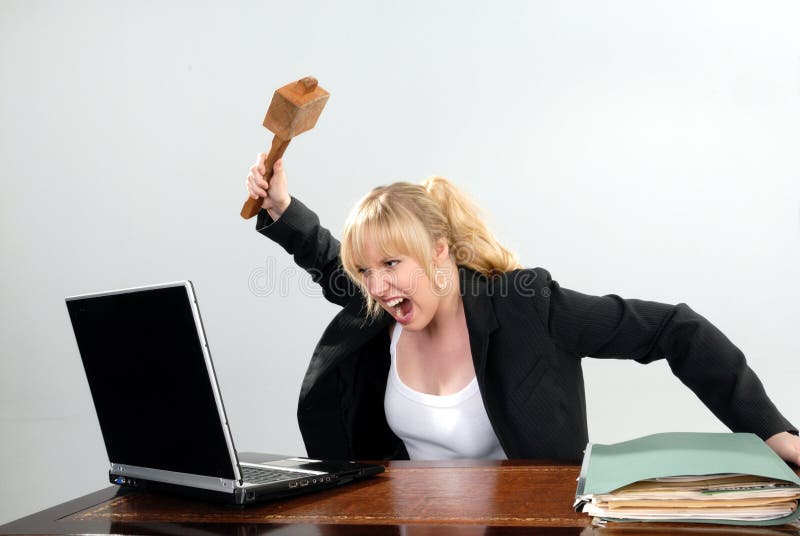 Cute businesswoman angry with PC