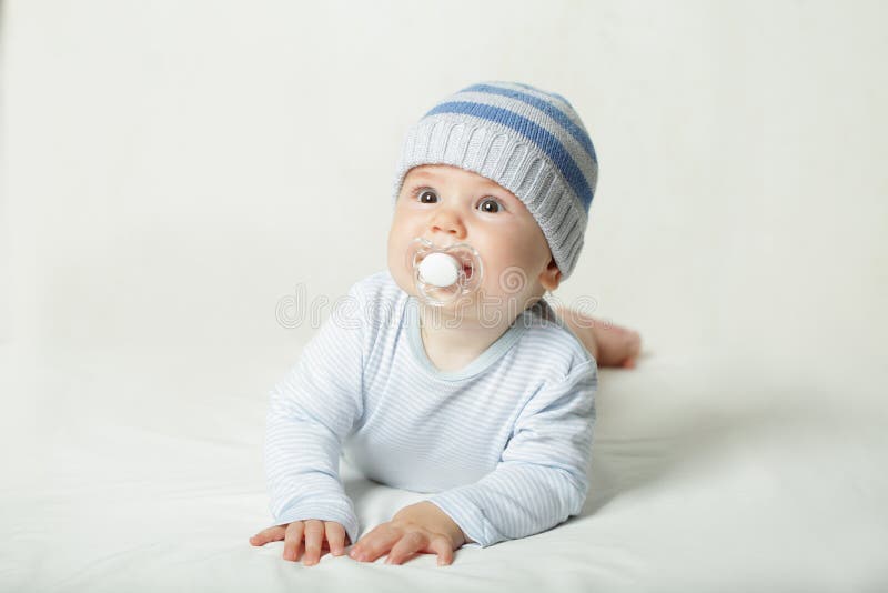 Cute child - baby with pacifier royalty free stock photography