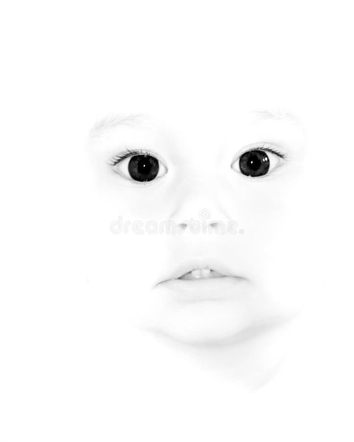 Cute child with big dark eyes in high key