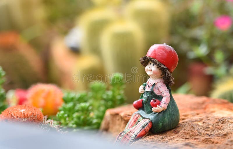 Cute child Dolls in garden stock image. Image of grass 95938379