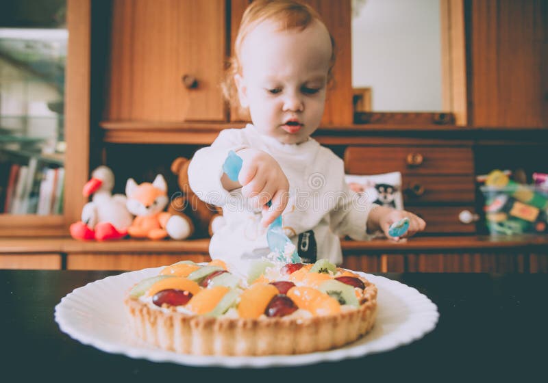 Cute child eating his birthday cake stock photos Cute child eating his birthday cake stock photos