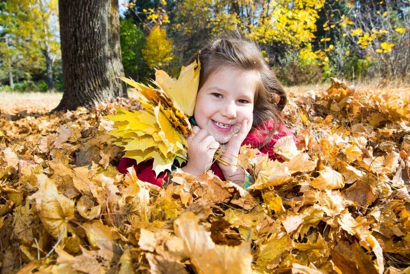 Cute Child Girl Playing with Fallen Leaves in Autumn Stock Image ...