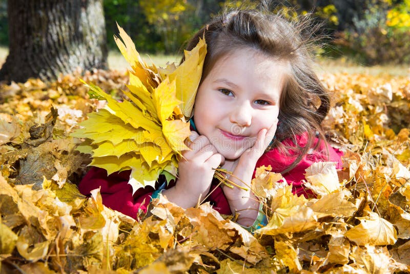 Cute Child Girl Playing with Fallen Leaves in Autumn Stock Image ...