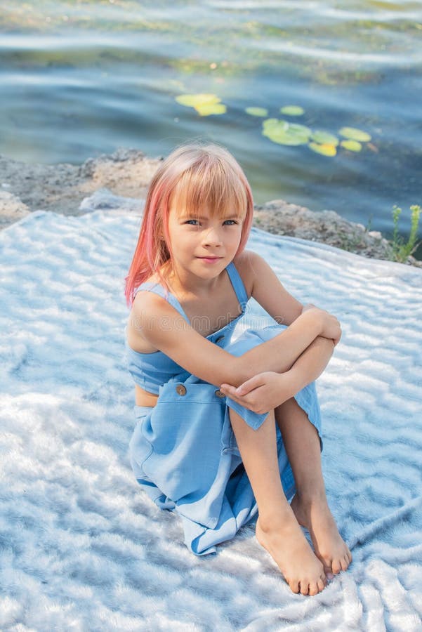 Cute child girl portrait . Outdoor portrait of cute little girl in summer day. Portrait of a little girl with pink hair