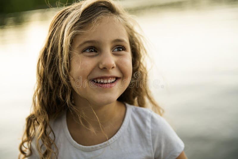 Cute Child Girl on a Wooden Platform by the Lake. Stock Image - Image ...