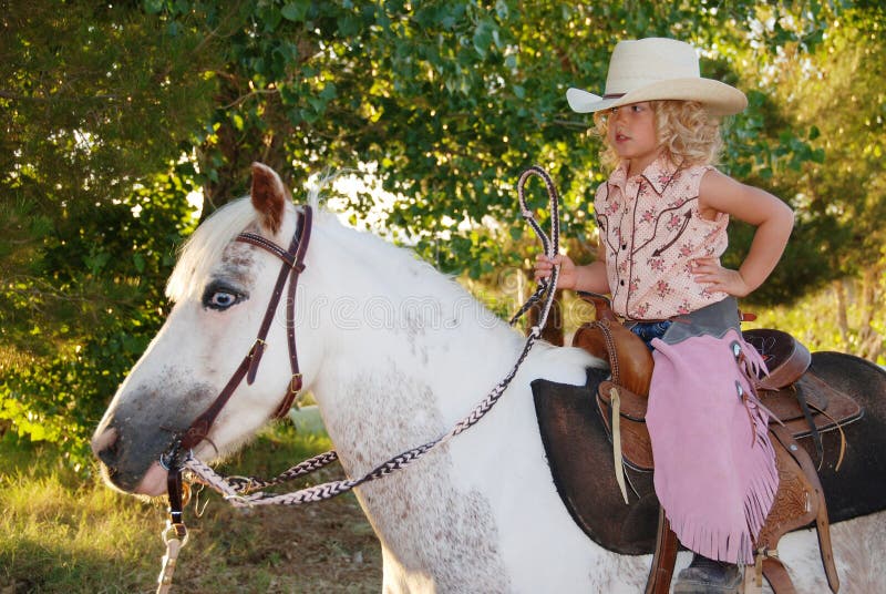 Cute child on a pony.