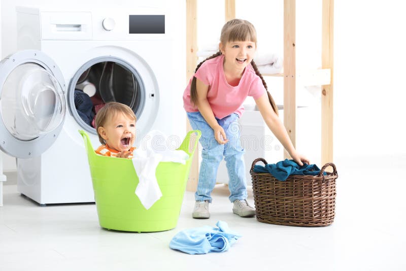 Cute children doing laundry stock photo Cute children doing laundry stock photo