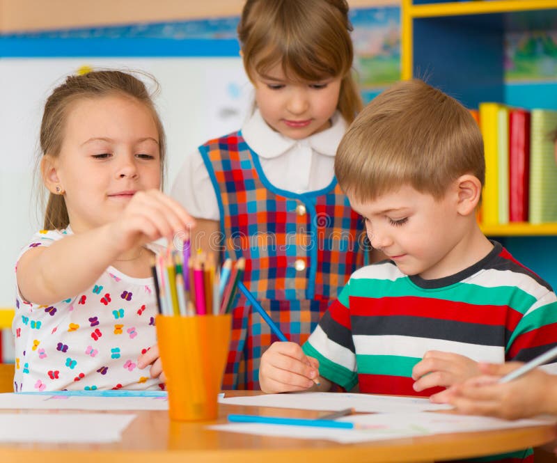 Cute children study at daycare stock image