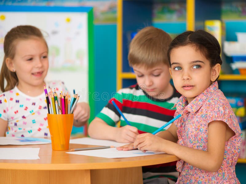 Cute children study at daycare royalty free stock images