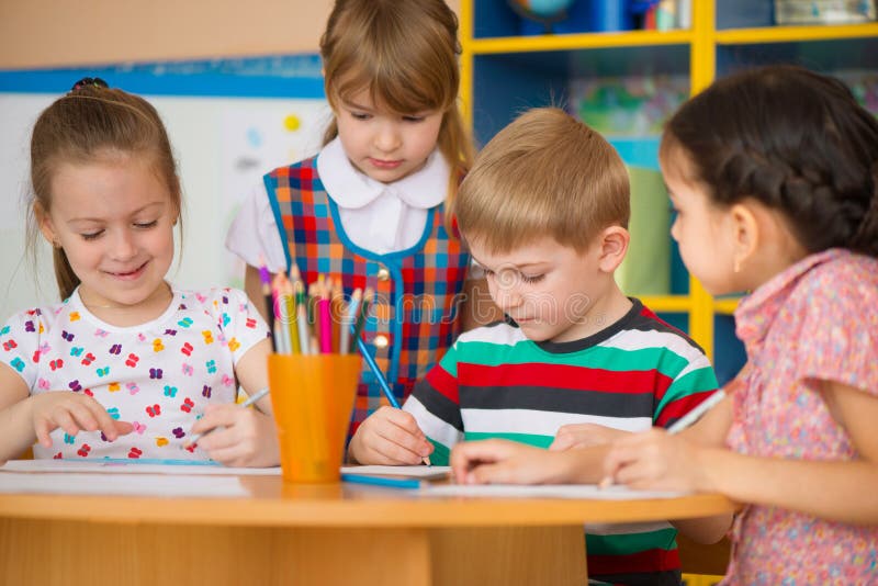 Cute children study at daycare stock photo