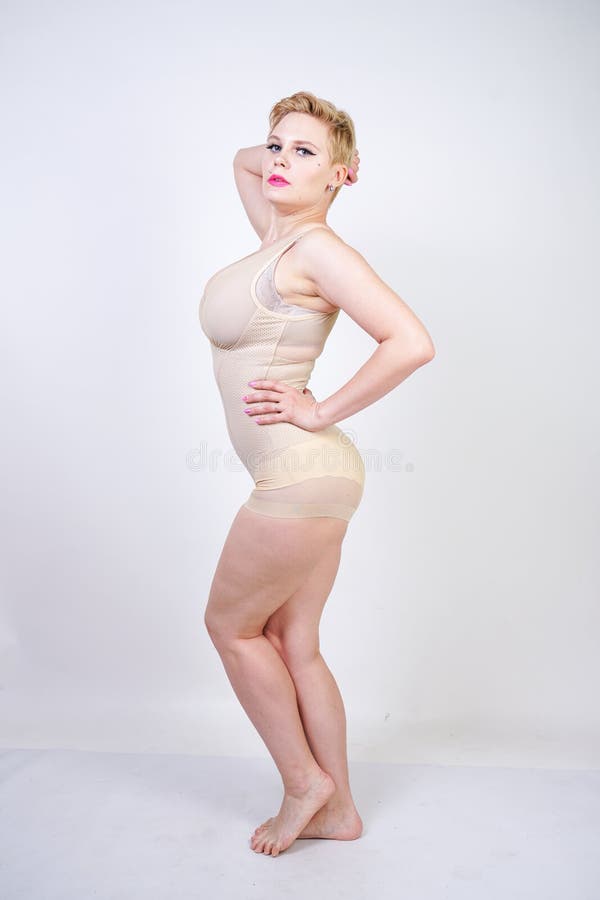 Cute Chubby Girl with Short Hair and a Curvy Figure Dressed in Beige Tight  Shapewear on a White Background in the Studio Stock Image - Image of  collection, dressed: 149352829