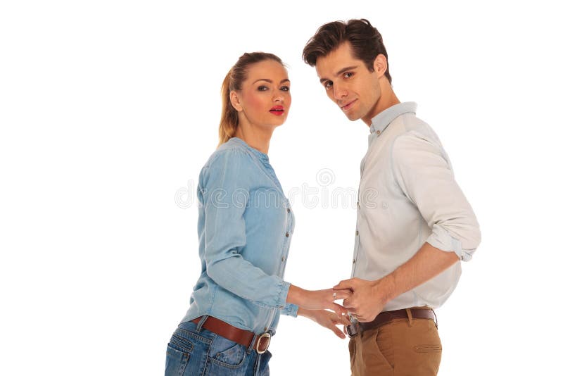 Cute couple posing holding hands