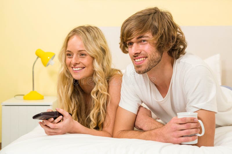 Cute Couple Lying Bed Watching Tv Stock Photos Free & RoyaltyFree
