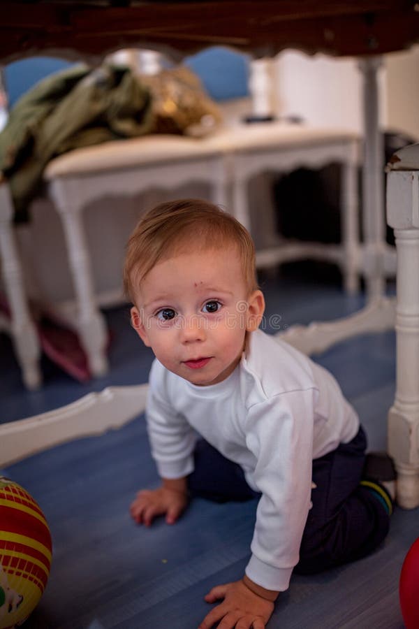 Cute Crawling Baby Boy Under a Table Stock Photo Image of love, little 137191184