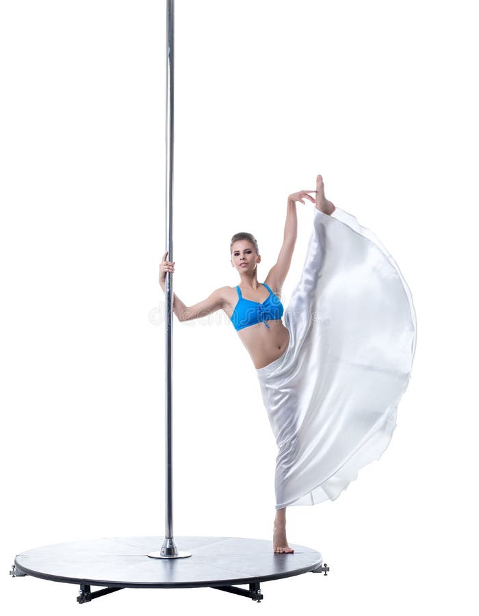 Cute dancer posing in vertical split on pylon stock photos