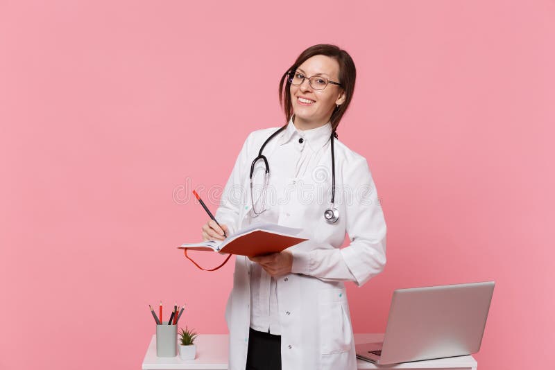 Cute Female Doctor Stand In Front Of Desk With Pc Computer