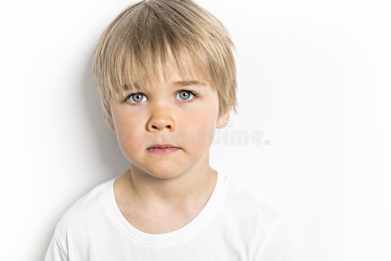 A cute five year old boy studio portrait on white background royalty free stock image A cute five year old boy studio portrait on white background royalty free stock image