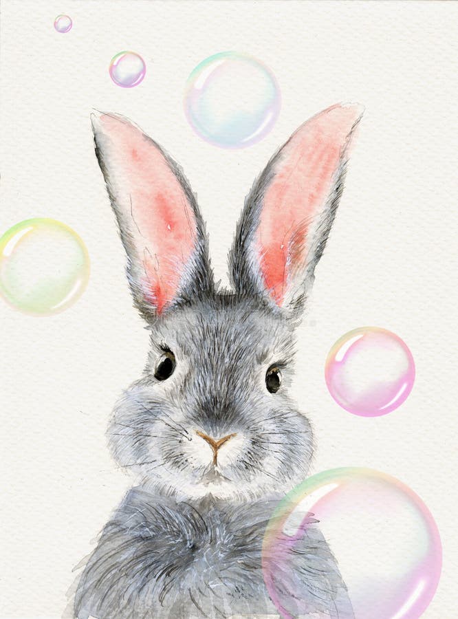 A cute fluffy grey rabbit with with colorful soap bubbles